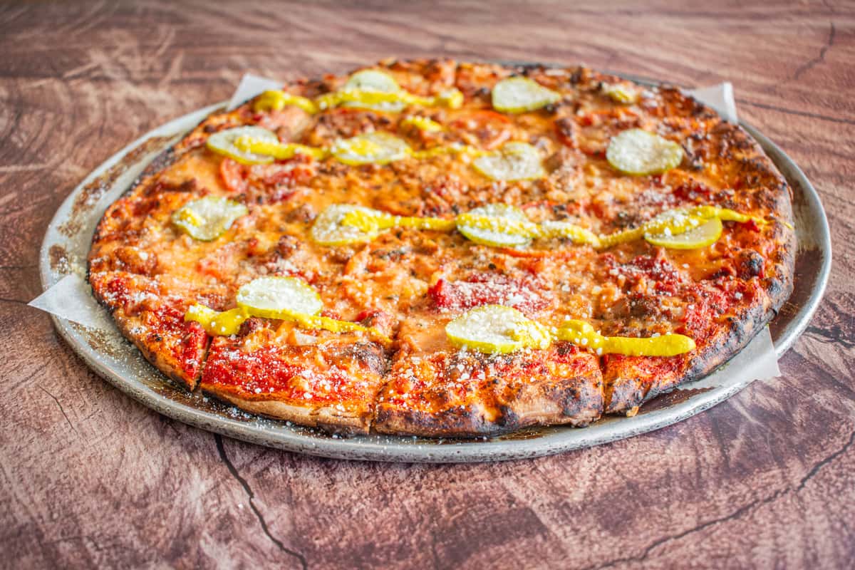 A St. Louis-style "Big Boy" pizza topped with layers of melted cheese, pepperoni, sausage, onions, and savory seasonings on a crispy golden crust. Baked to perfection, this hearty specialty pizza delivers bold flavors and is perfect for sharing with family and friends.
