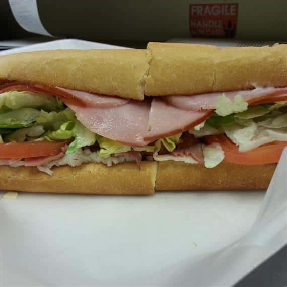 turkey sub with pickles, lettuce and tomato