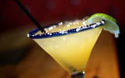 margarita on the rocks with salted rim and a lime