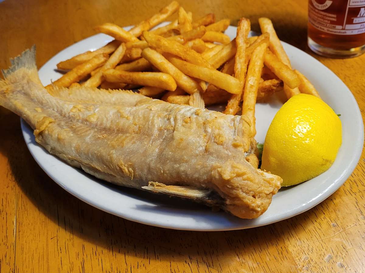 Whole Catfish and fries lemon wedge