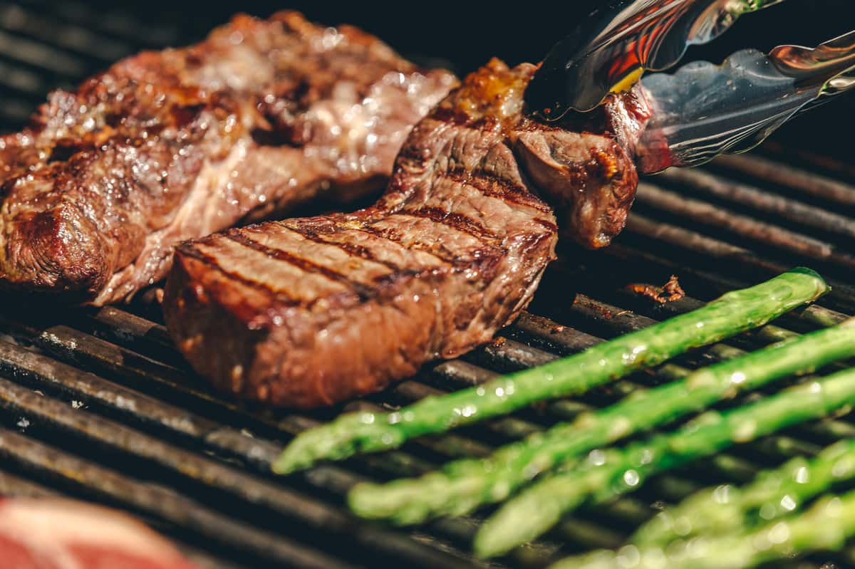 steak and asparagus on a grill