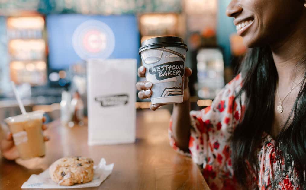 Woman drinking a WTB coffee