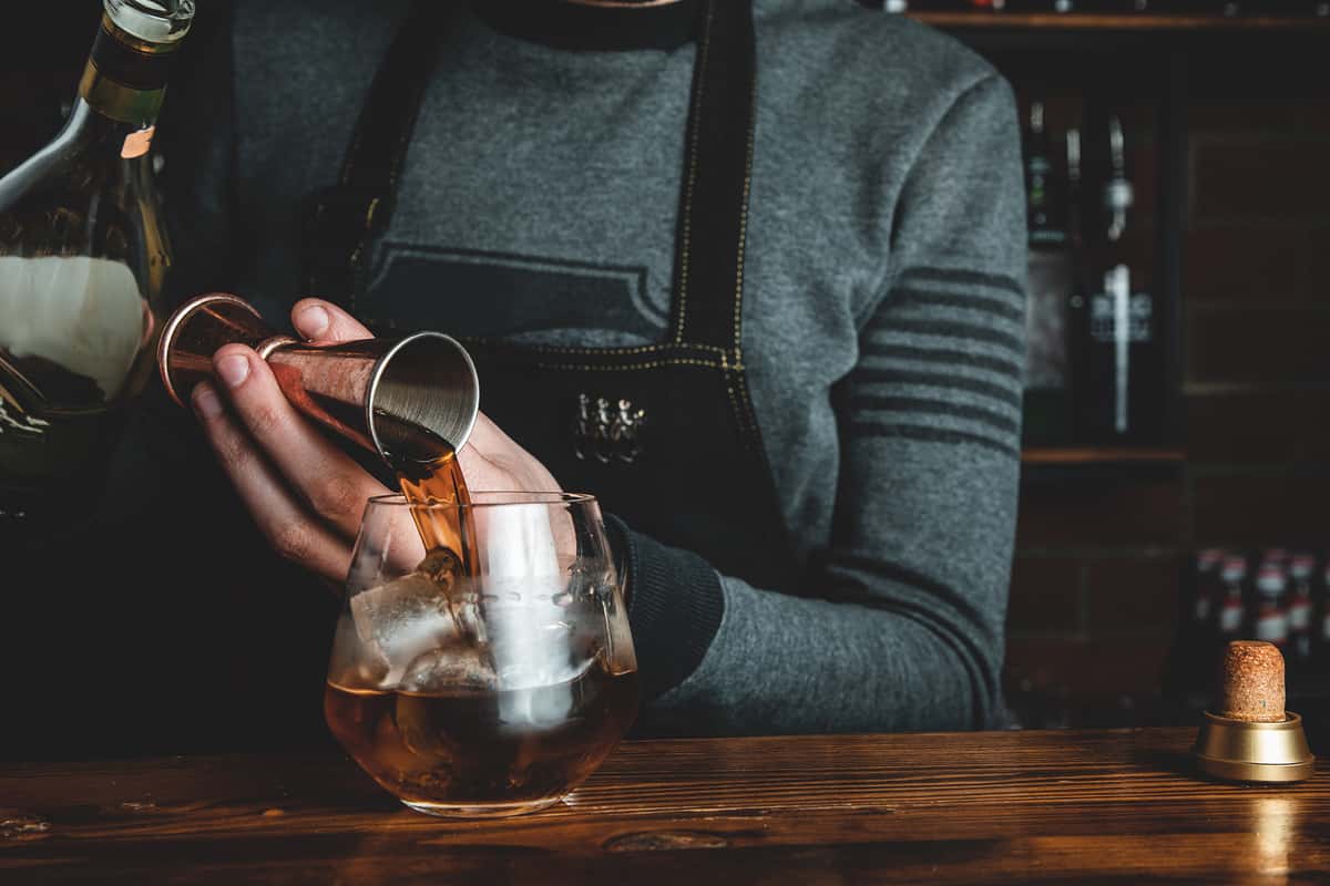 Bartender pouring a cocktail