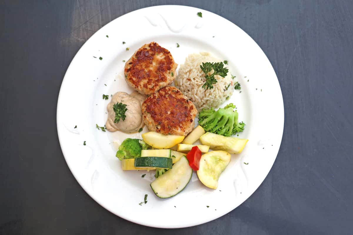 Remoulade sauce, rice pilaf, and vegetable