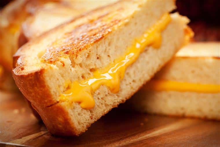 Grilled cheese sandwiches on cutting board
