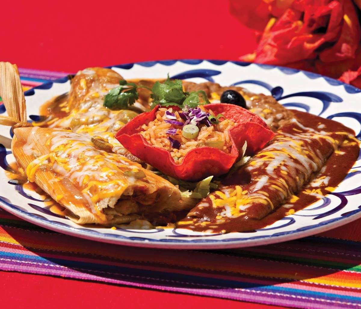 Three of Mexico's most beloved dishes on one Plate  - Chili Relleno, Tamal, and Enchilada. Each dish boasts a unique combination of flavors, textures, and aromas that will transport your senses straight to the heart of Mexico.