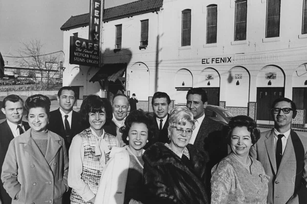 group of people standing in front of original el fenix