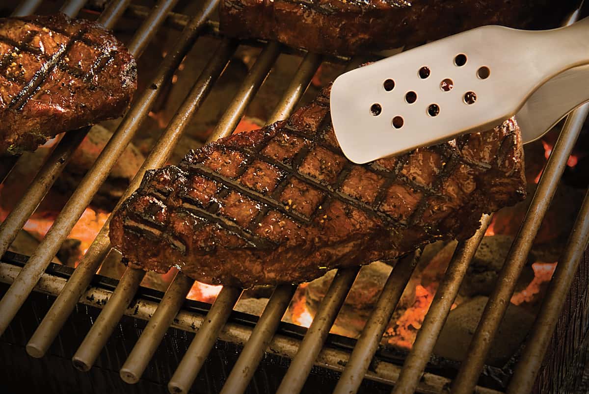 steaks on a grill