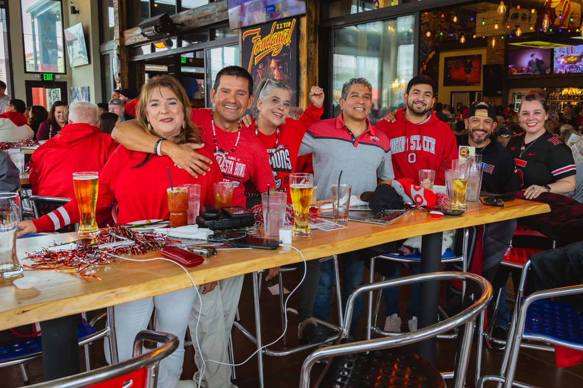 Sports bar interior packed with fans watching a football game on multiple TVs in Oviedo, FL