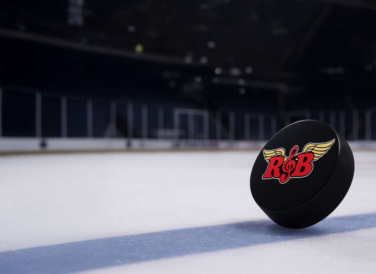 Black Rock & Brews hockey puck on the ice, with large "HOCKEY" text over the image.