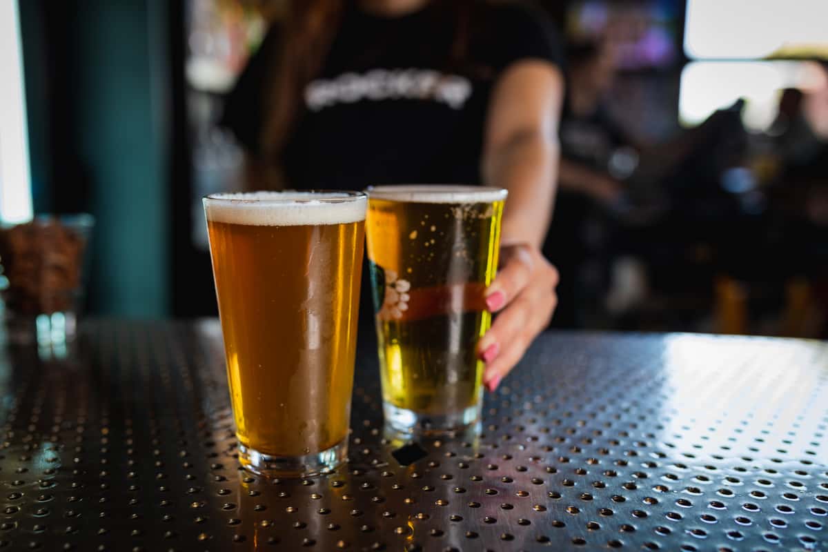 Server bringing pints of beer