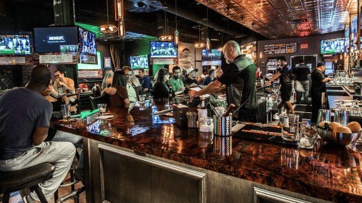 The bar at Frankie's Downtown with games playing on the TVs