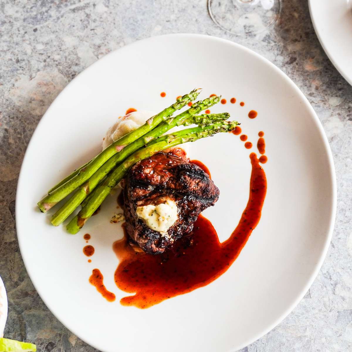 Filet mignon with blue cheese butter, grilled asparagus and red wine demi-glace