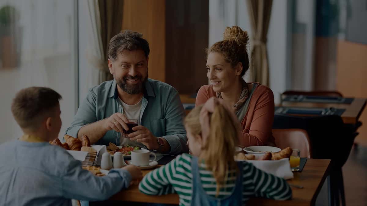 a family shares breakfast at a restaurant