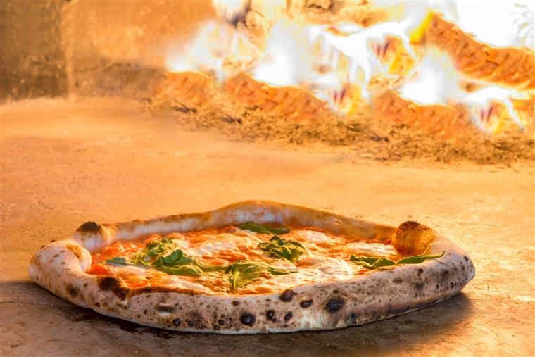 margherita pizza in a woodfire oven