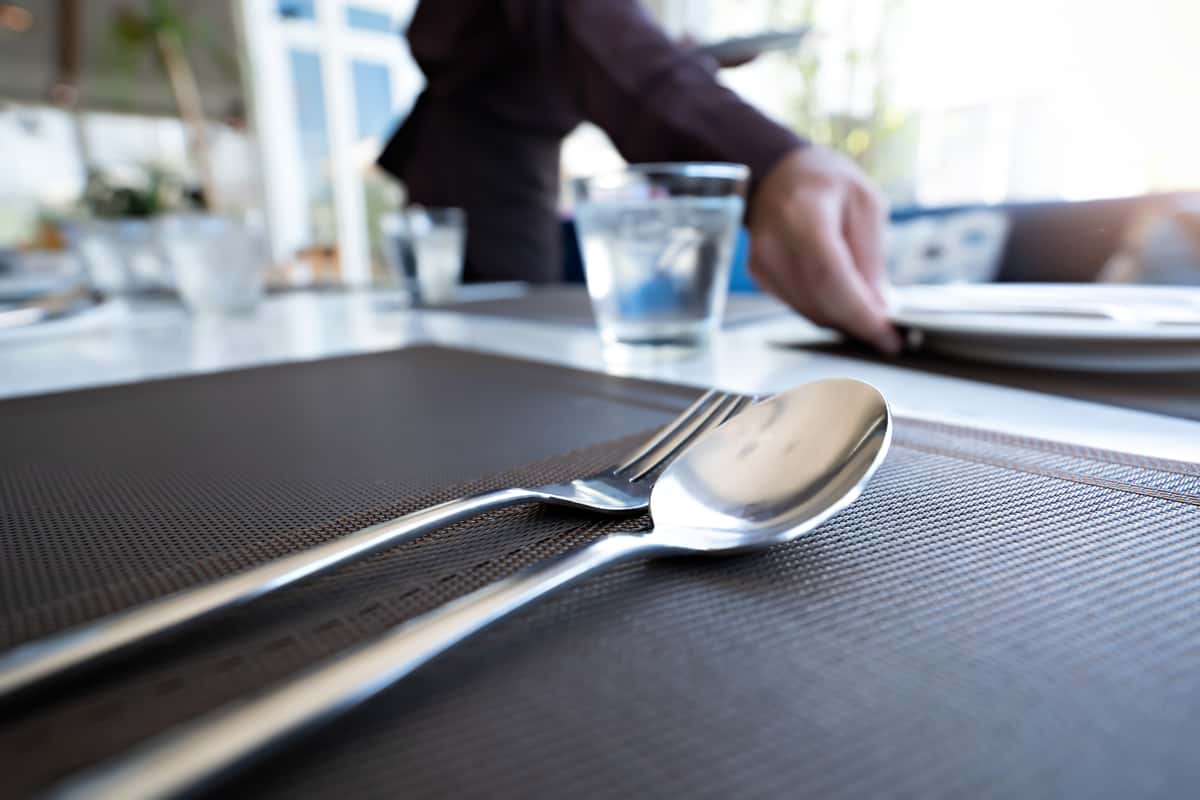fork and spoon with server setting table