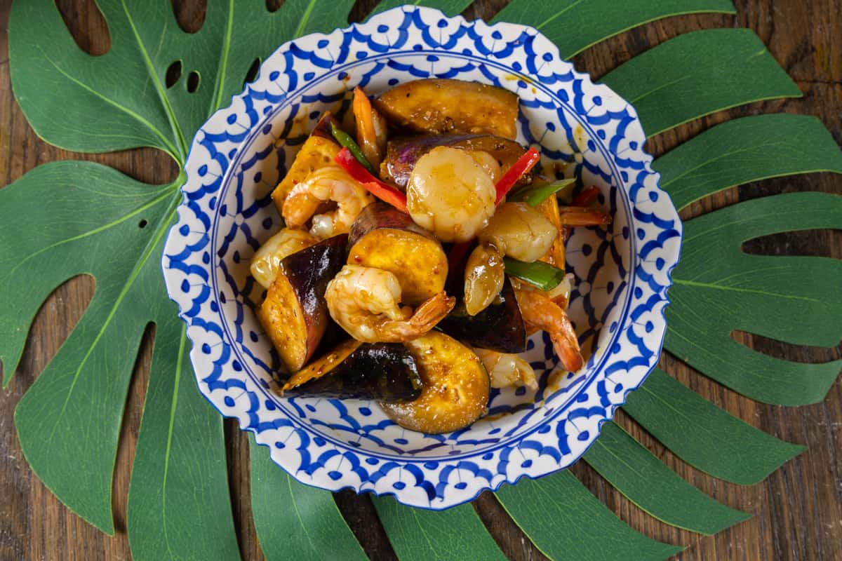 Spicy Thai stir-fry with tender chicken, fresh vegetables, and aromatic herbs tossed in a bold savory sauce, delivering rich flavor and authentic Thai comfort in every bite.