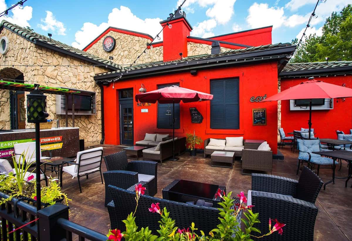 Exterior view of Sivas Tavern featuring outdoor patio dining and modern restaurant lounge design