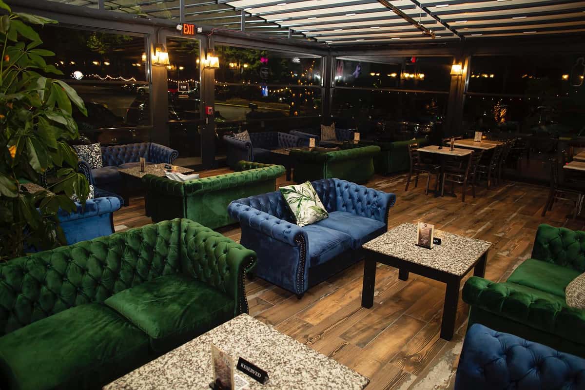 Outdoor lounge seating at Sivas Tavern with modern patio furniture and stylish nightlife ambiance