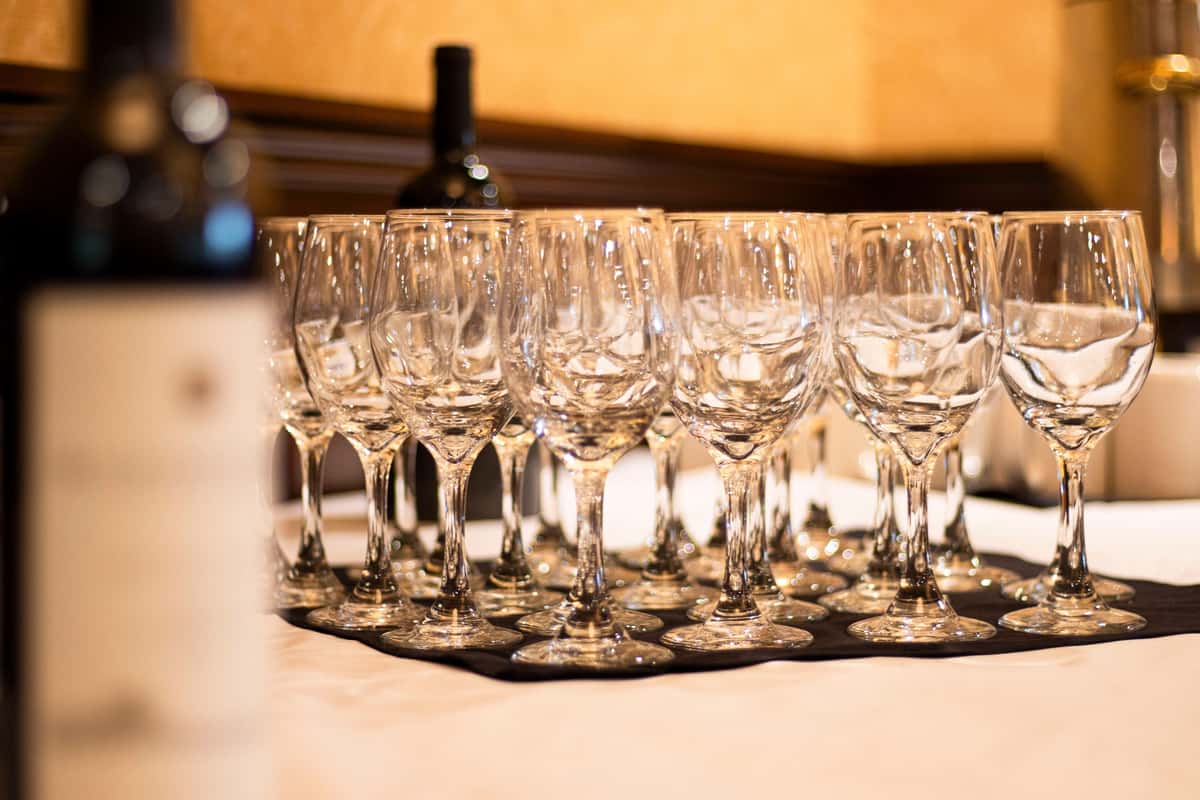 table of wine glasses for catered event
