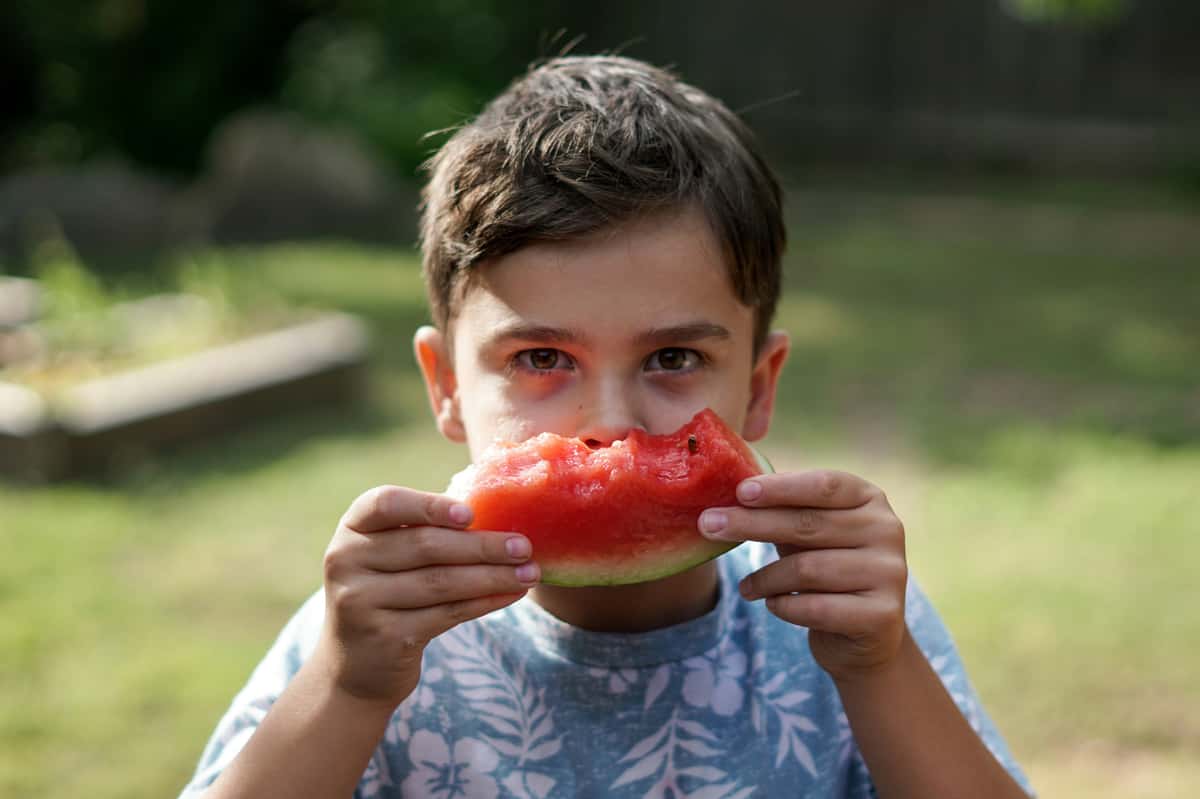 Boy eating watermelon