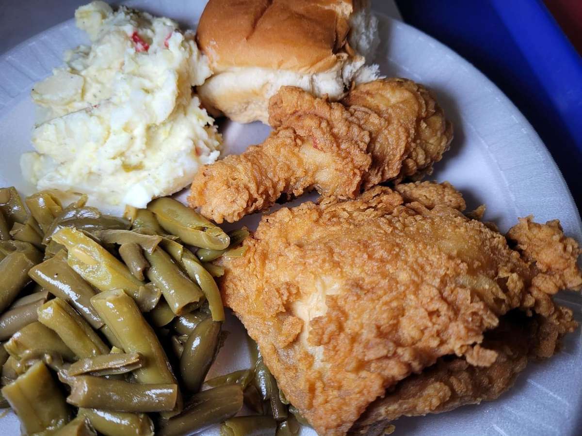Crispy Fried Chicken, green beans, mashed potatoes and dinner roll.