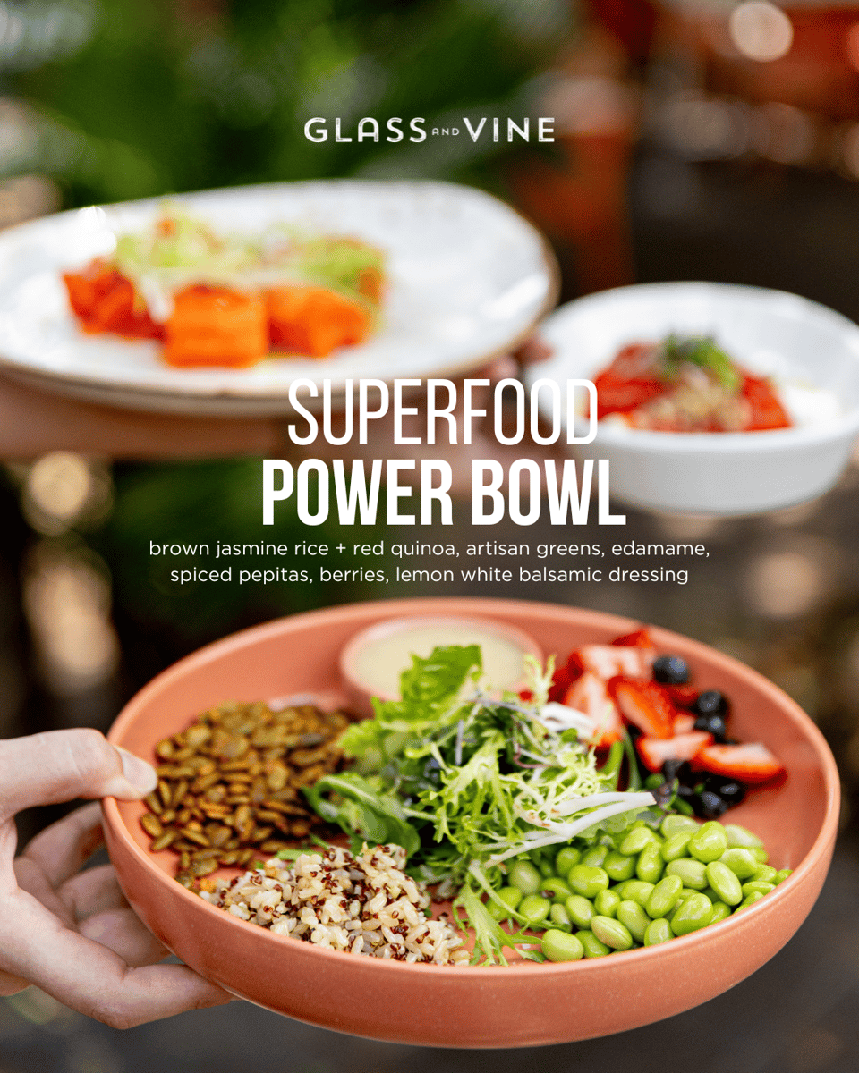 Glass & Vine superfood power bowl with quinoa, greens, edamame, berries, and lemon dressing