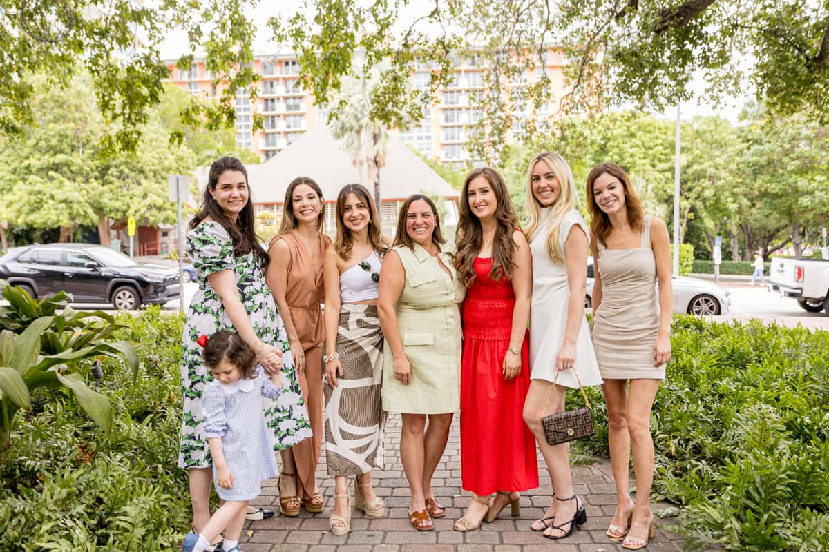 Group of colleagues posing together during a corporate social gathering