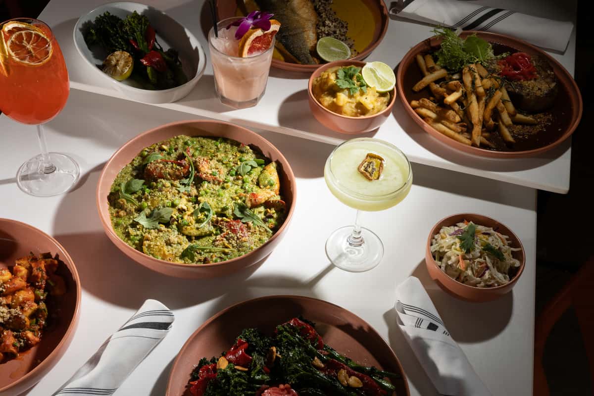 Seasonal dishes and cocktails served at Glass & Vine for a shared dining experience