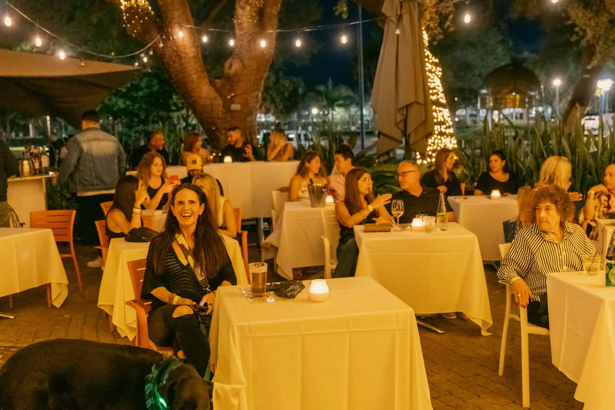 Guests socializing during a private party on a restaurant patio