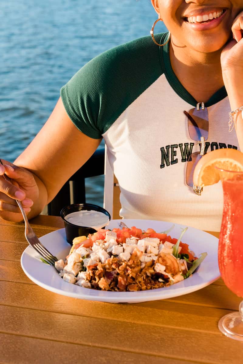 Person enjoying food at Whiskey Joe's