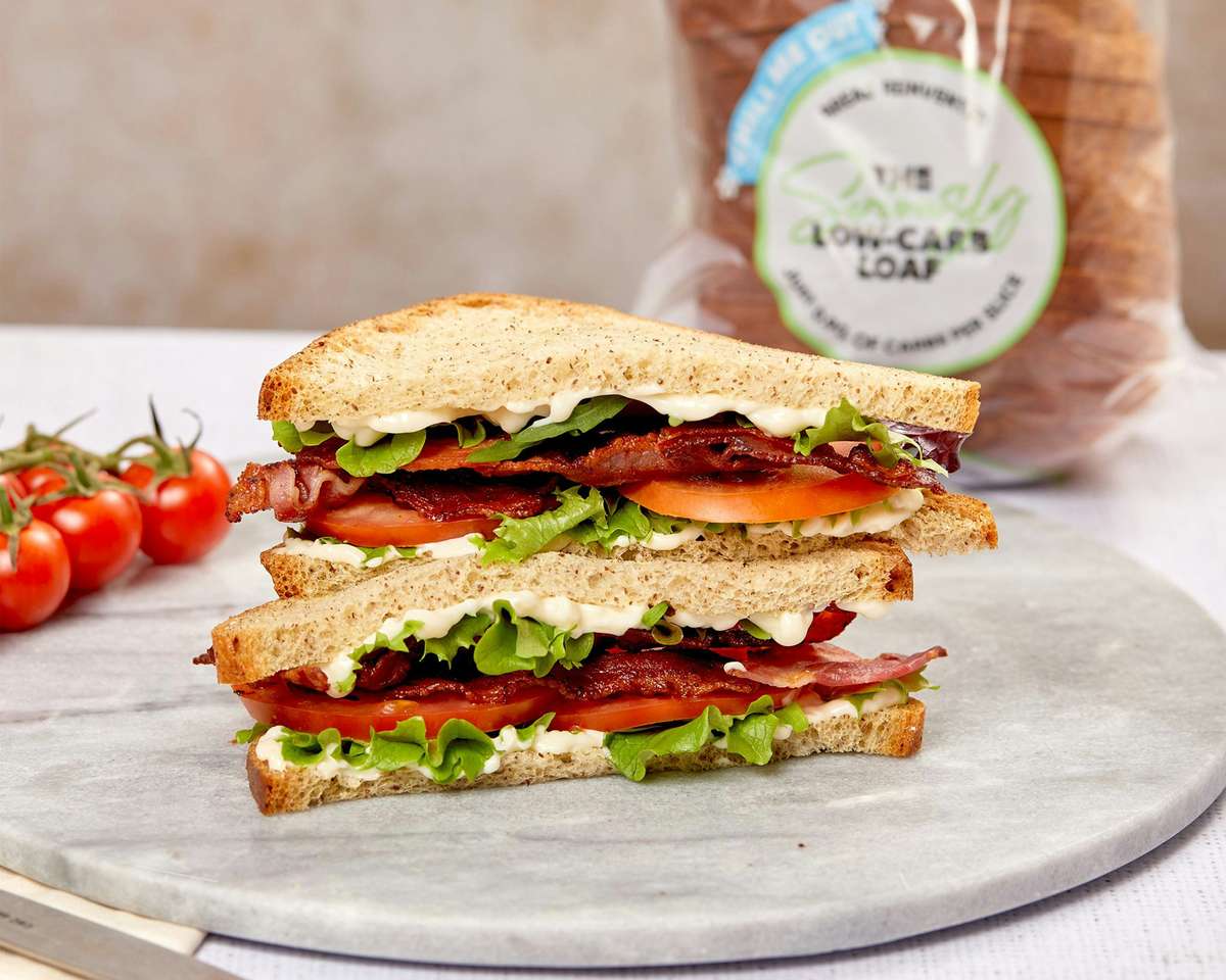 Classic BLT sandwich with crispy bacon, fresh lettuce, ripe tomato, and creamy mayo on sliced whole wheat bread.