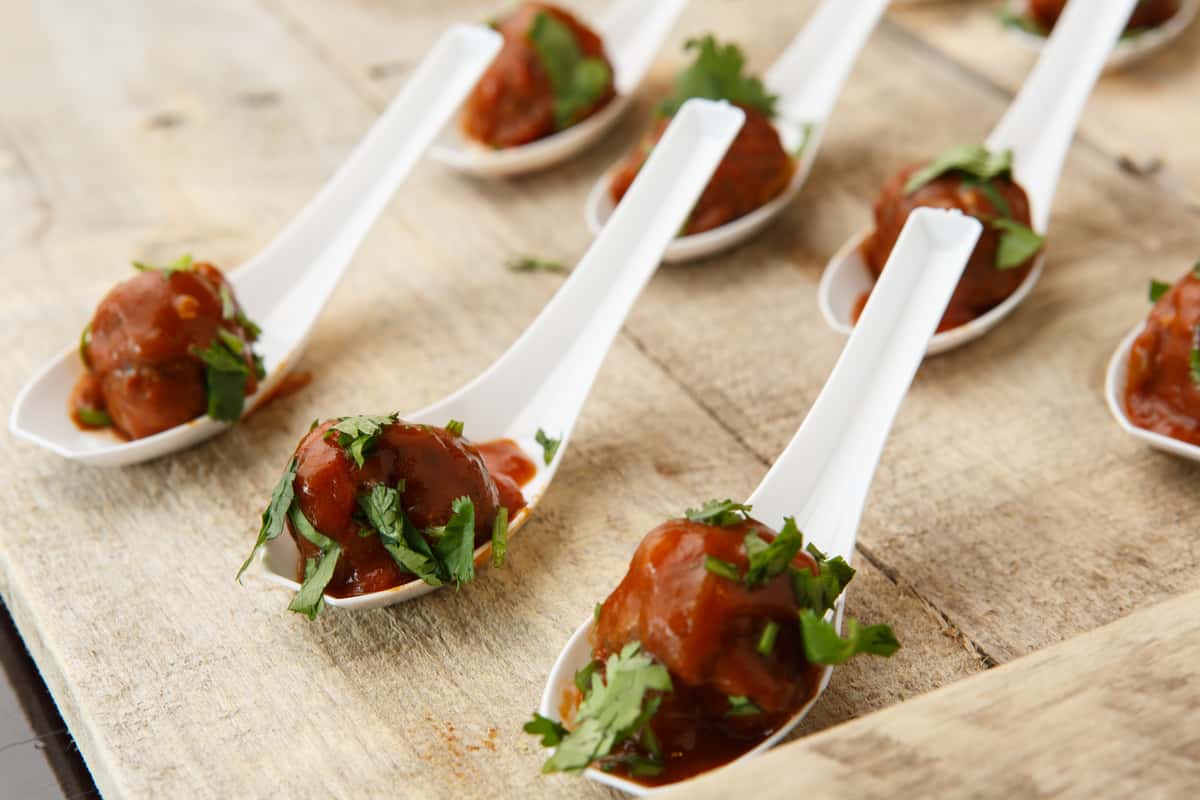 meatballs in white spoons