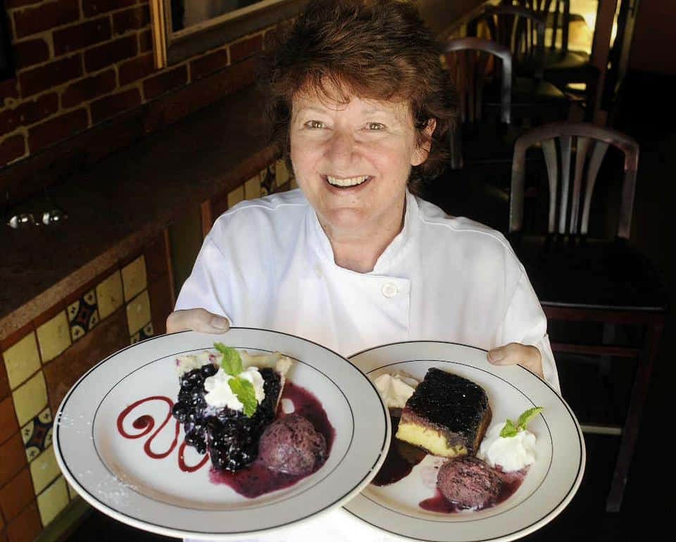 chef holding plates of food