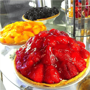 Seasonal fresh fruit pies on counter