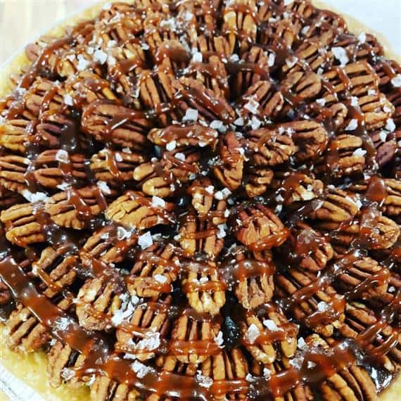 pecan pie with caramel drizzle and sea salt flakes
