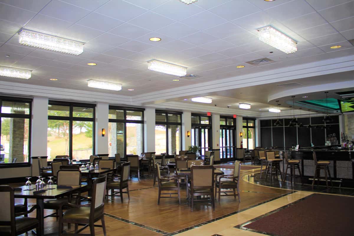 Interior view of dining area with tables and chairs