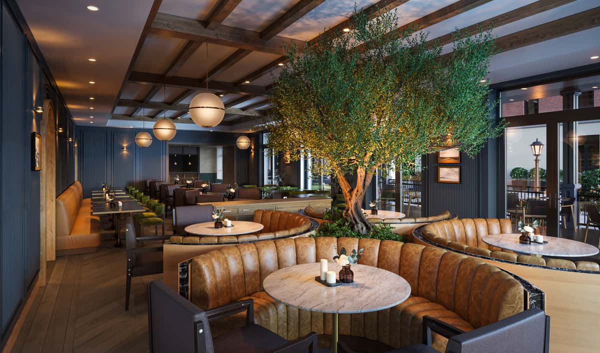 Elegant restaurant interior featuring circular leather booths, round marble tables, and a large illuminated tree as the centerpiece.