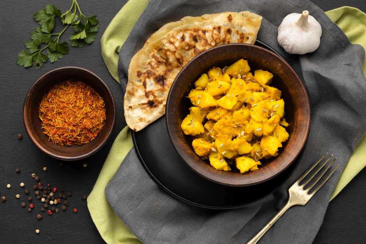 chicken curry with naan and spices