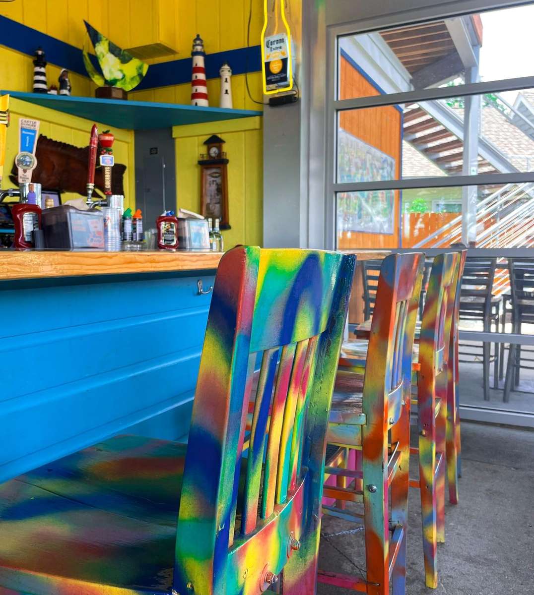 Bar area with colorful chairs
