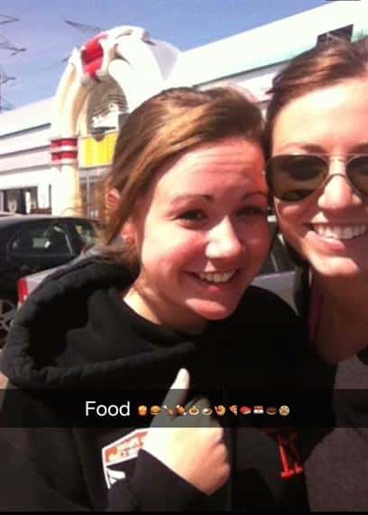 two girls standing outside the carol stream location with caption that says 'food' with assorted food item icons