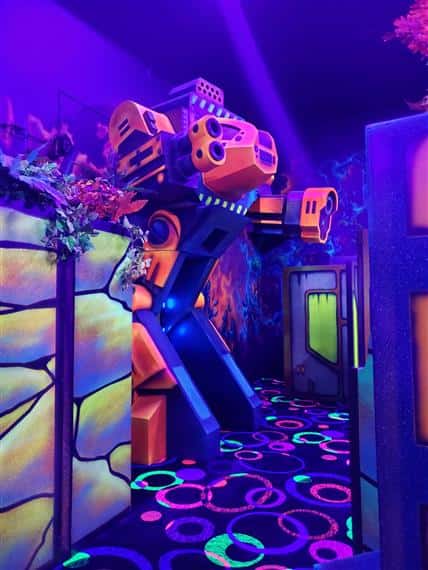 Laser Tag arena with black light and neon colored objects