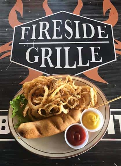 corndog with onion rings on the side