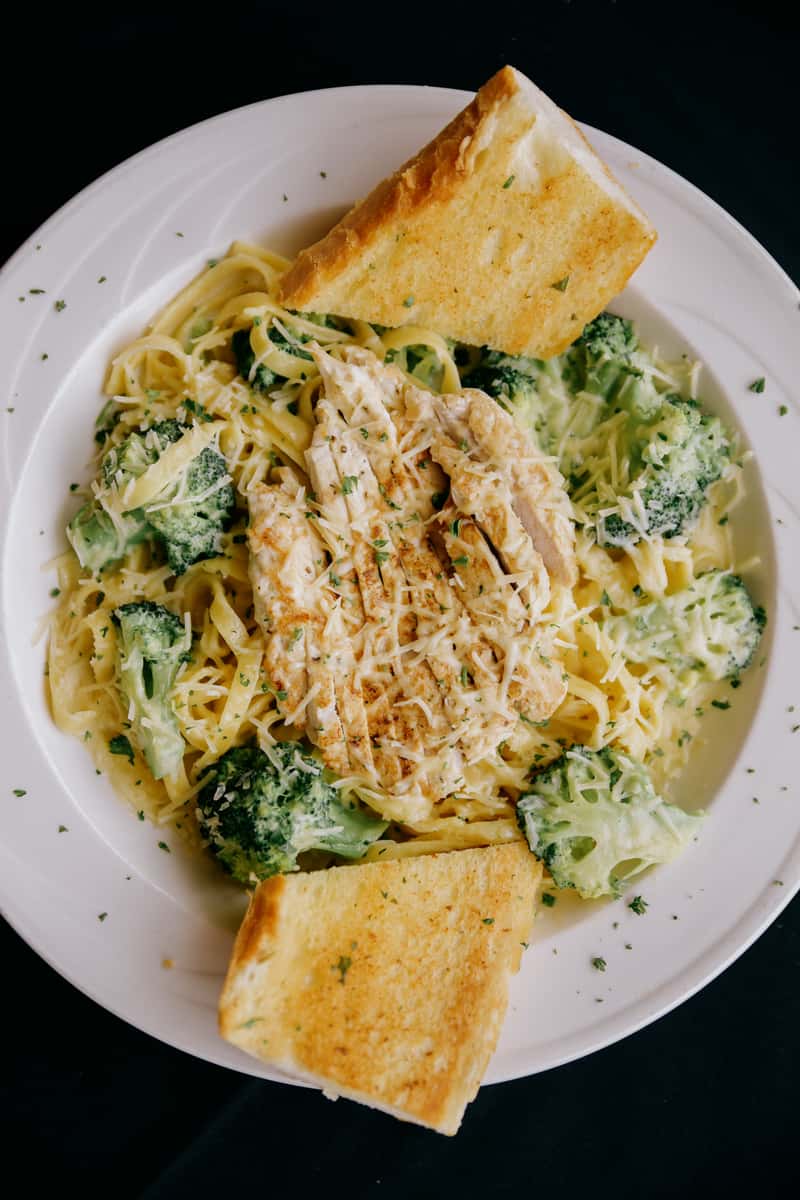 Tossed in a creamy Alfredo sauce with fresh broccoli.
