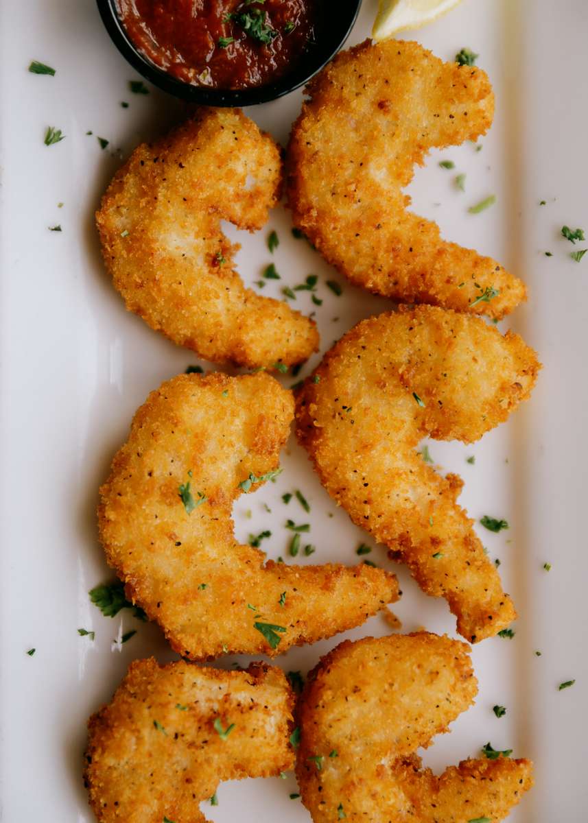 Jumbo shrimp hand-breaded in seasoned Japanese panko crumbs, flash-fried to golden perfection, served with cocktail sauce and lemon.