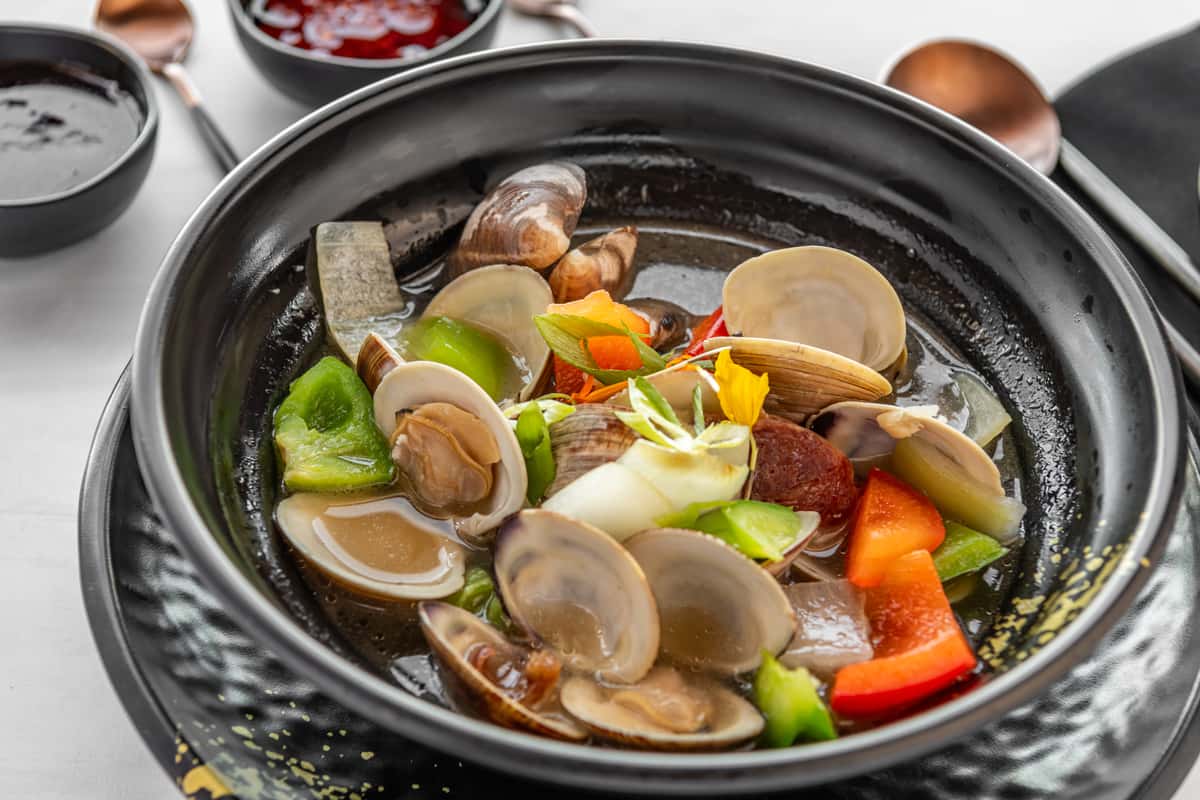 Clams with Chinese sausage in a garlic, onion, and Rainier beer sauce.
