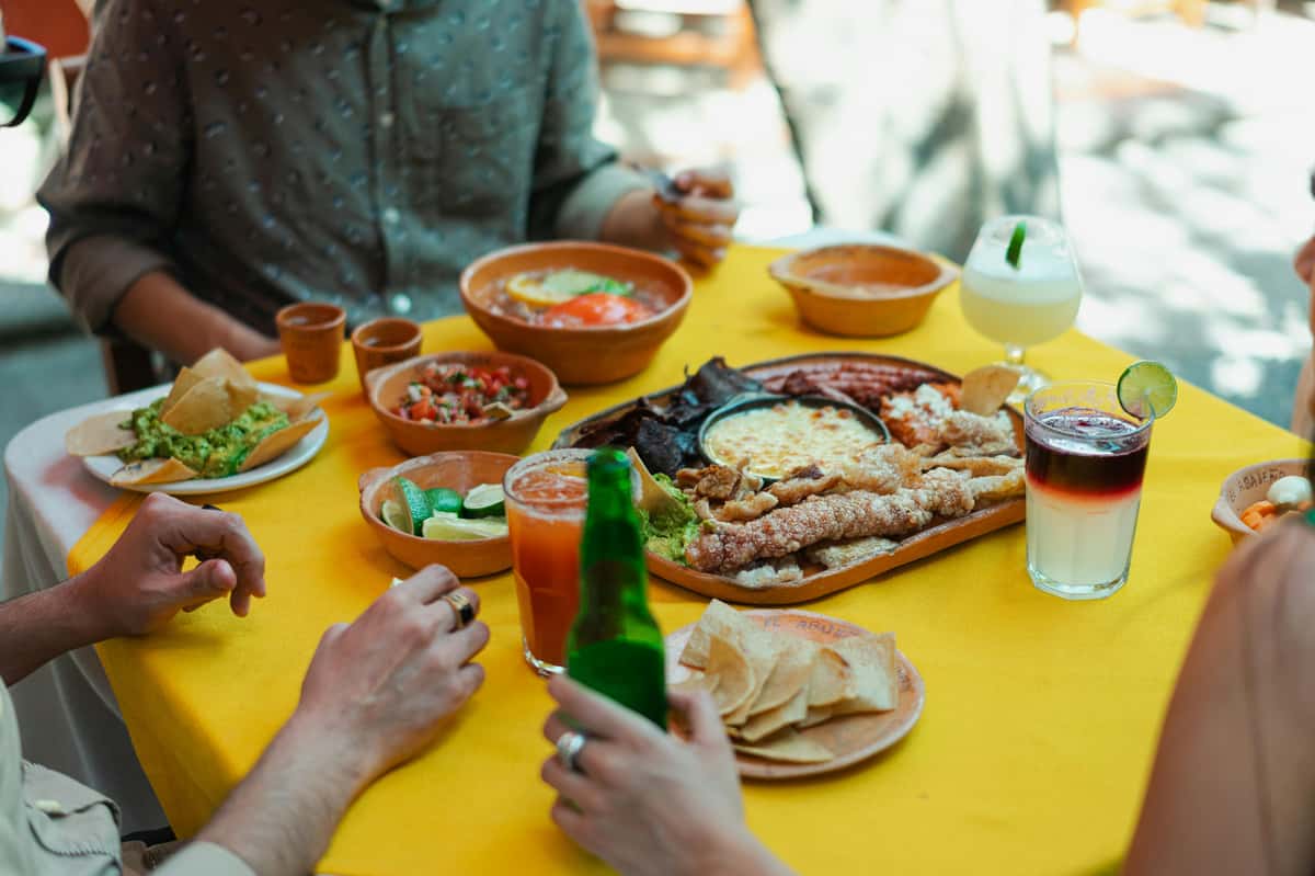 spread of food on the table while diners enjoy