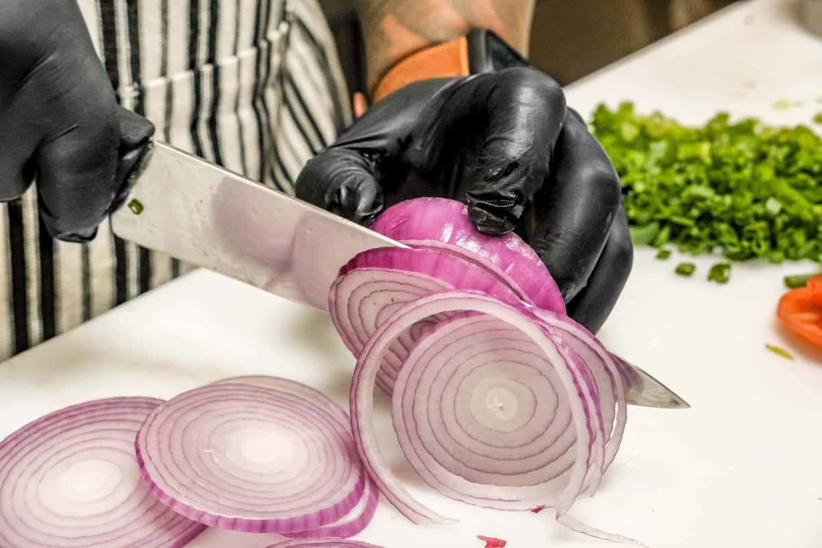 chef cutting onions