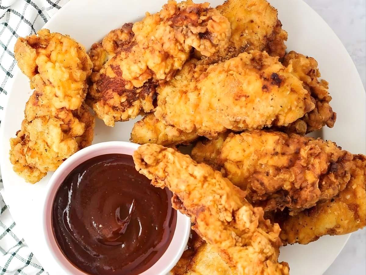Crispy fried chicken tenders served with barbecue dipping sauce.