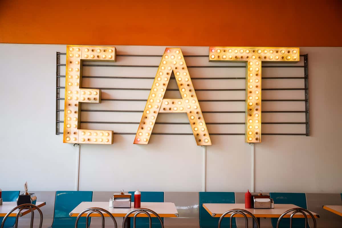 "EAT" sign on wall inside Shake Shake Shake